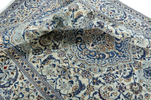 Surface texture of 2000s Nain rug with natural Wool and intricate pattern