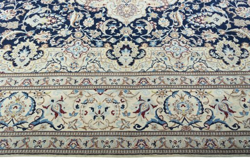 Corner detail of 2000s Nain rug showing border pattern and Wool pile