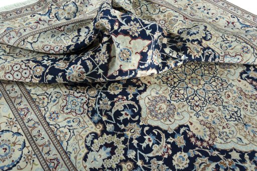 Surface texture of 2000s Nain rug with natural Wool and intricate pattern