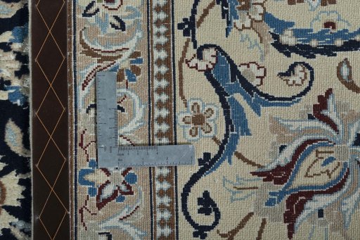 Backside of handmade 2000s Nain rug showing knot structure and weave density