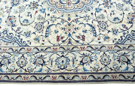Corner detail of 2000s Nain rug showing border pattern and Wool pile
