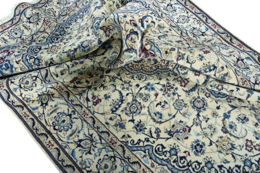 Surface texture of 2000s Nain rug with natural Wool and intricate pattern