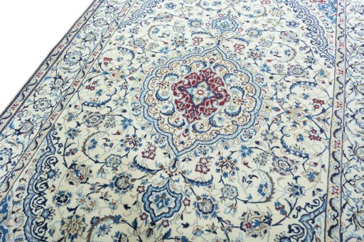 Backside of handmade 2000s Nain rug showing knot structure and weave density