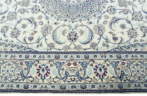 Corner detail of 2000s Nain rug showing border pattern and Wool pile