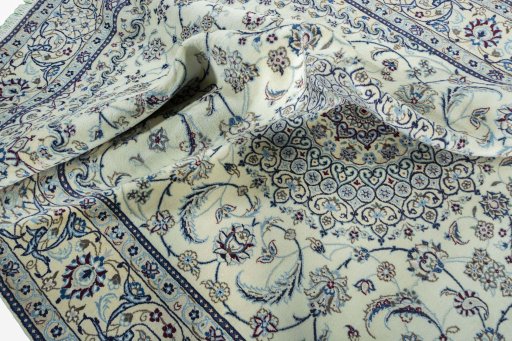 Surface texture of 2000s Nain rug with natural Wool and intricate pattern