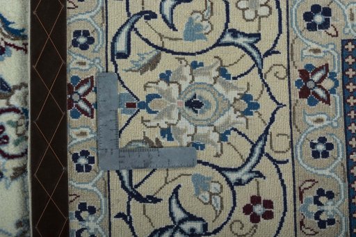 Backside of handmade 2000s Nain rug showing knot structure and weave density