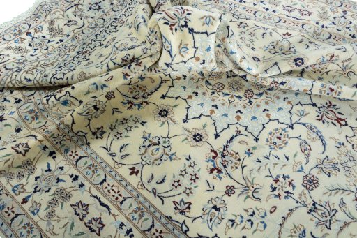 Surface texture of 2000s Nain rug with natural Wool and intricate pattern