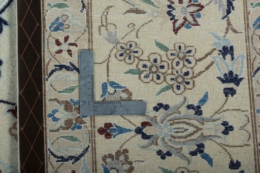 Backside of handmade 2000s Nain rug showing knot structure and weave density