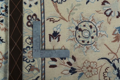 Backside of handmade New Nain rug showing knot structure and weave density