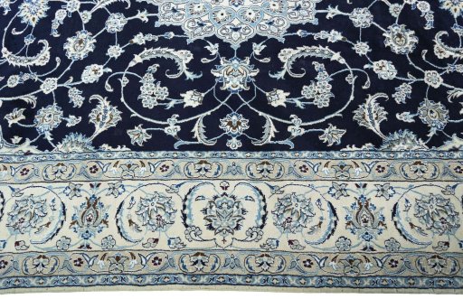 Corner detail of New Nain rug showing border pattern and Wool pile