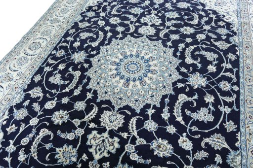 Backside of handmade New Nain rug showing knot structure and weave density