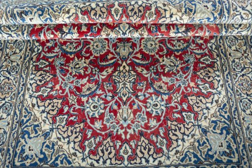 Corner detail of New Nain rug showing border pattern and Wool pile