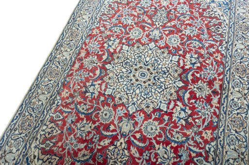Backside of handmade New Nain rug showing knot structure and weave density