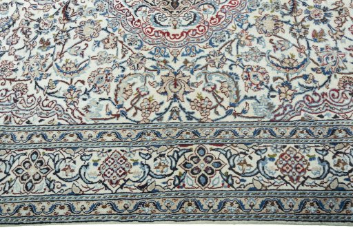 Corner detail of 2000s Nain rug showing border pattern and Wool pile