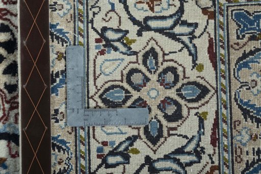Backside of handmade 2000s Nain rug showing knot structure and weave density
