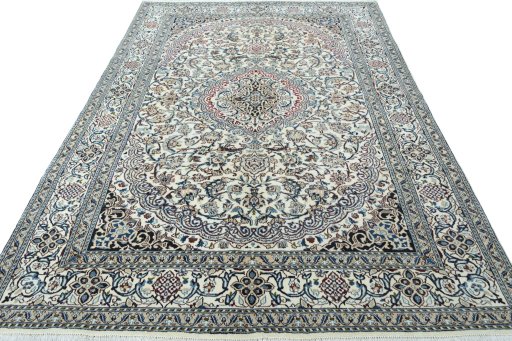 Surface texture of 2000s Nain rug with natural Wool and intricate pattern