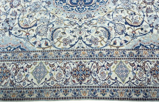 Corner detail of 2000s Nain rug showing border pattern and Wool pile