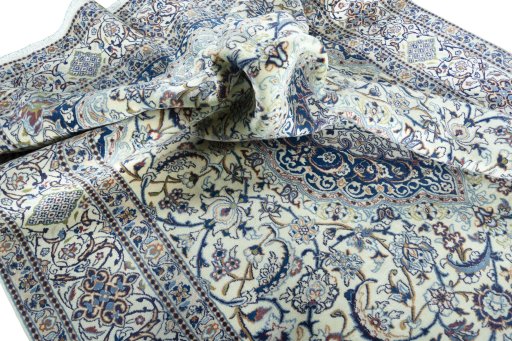Surface texture of 2000s Nain rug with natural Wool and intricate pattern