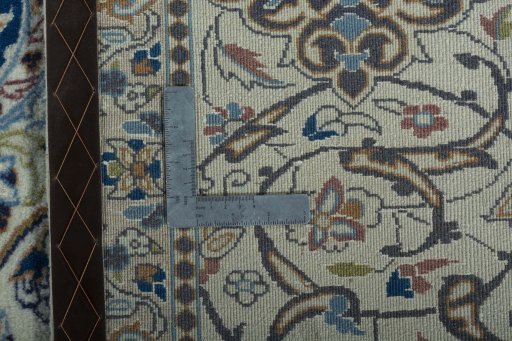 Backside of handmade 2000s Nain rug showing knot structure and weave density