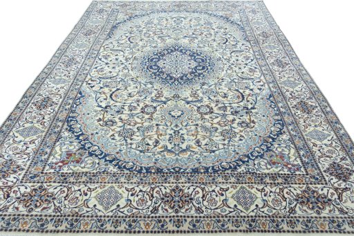 Surface texture of 2000s Nain rug with natural Wool and intricate pattern