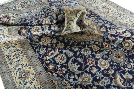 Surface texture of 2000s Nain rug with natural Wool and intricate pattern
