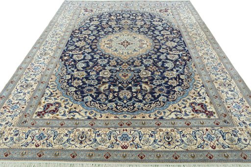 Surface texture of 2000s Nain rug with natural Wool and intricate pattern