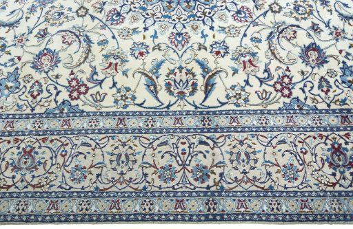Corner detail of 2000s Nain rug showing border pattern and Wool pile