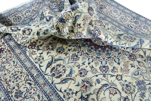 Surface texture of 2000s Nain rug with natural Wool and intricate pattern