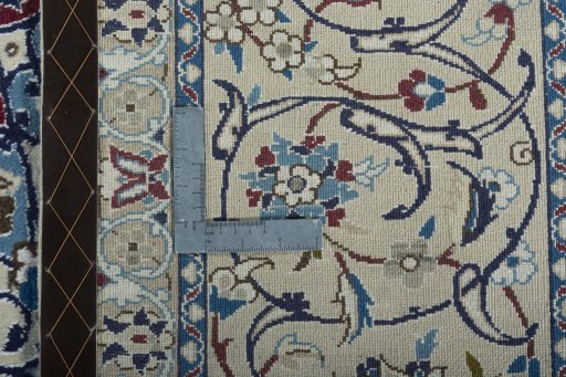 Backside of handmade 2000s Nain rug showing knot structure and weave density