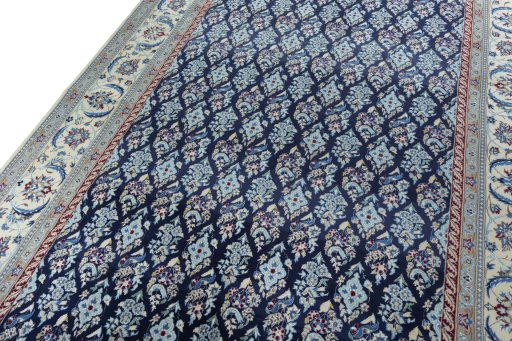 Backside of handmade New Nain rug showing knot structure and weave density