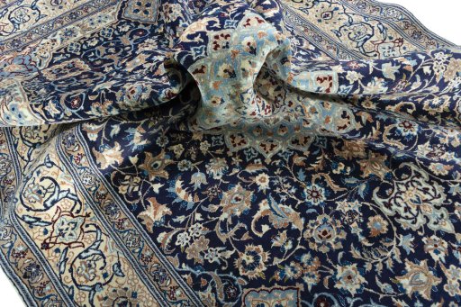 Surface texture of 2000s Nain rug with natural Wool and intricate pattern