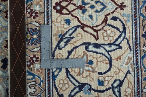 Backside of handmade 2000s Nain rug showing knot structure and weave density