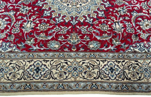 Corner detail of New Nain rug showing border pattern and Wool pile