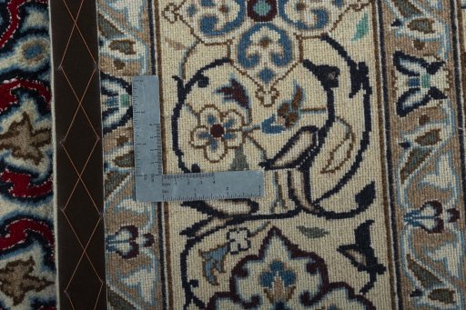 Backside of handmade New Nain rug showing knot structure and weave density