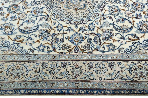 Corner detail of 2000s Nain rug showing border pattern and Wool pile