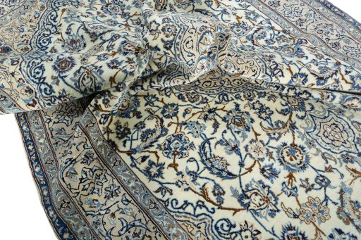 Surface texture of 2000s Nain rug with natural Wool and intricate pattern