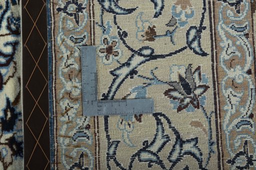 Backside of handmade 2000s Nain rug showing knot structure and weave density