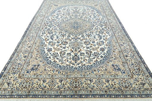 Surface texture of 2000s Nain rug with natural Wool and intricate pattern