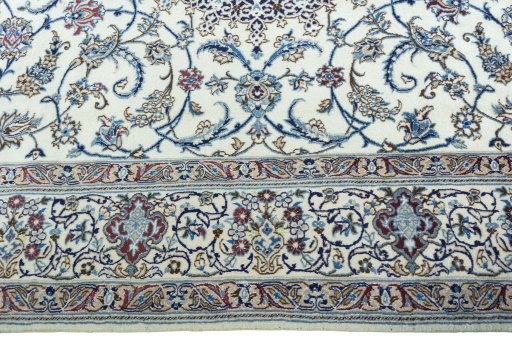 Corner detail of 2000s Nain rug showing border pattern and Wool pile