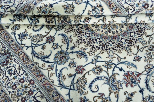 Close-up detail of 2000s Nain rug from Iran / Persia showing Wool weave