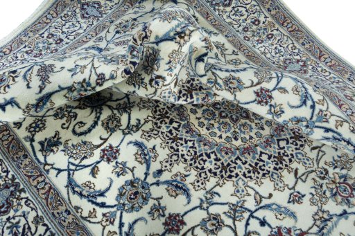 Surface texture of 2000s Nain rug with natural Wool and intricate pattern
