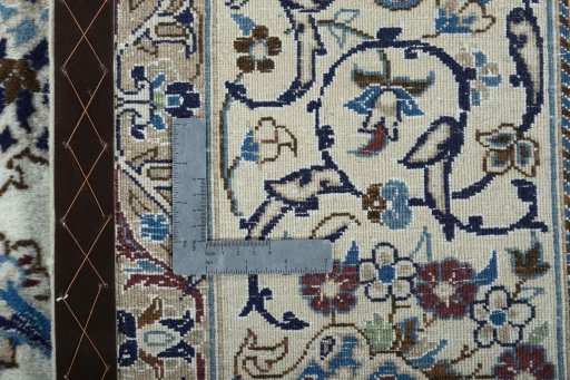Backside of handmade 2000s Nain rug showing knot structure and weave density