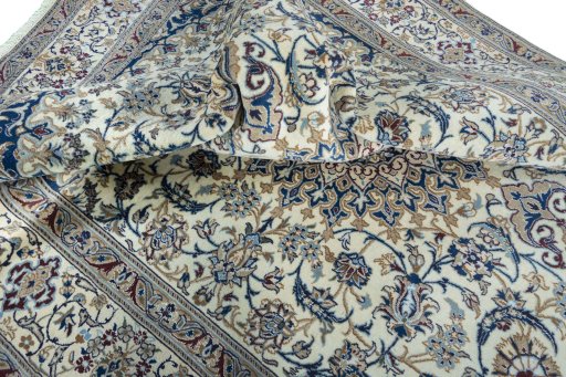 Surface texture of 2000s Nain rug with natural Wool and intricate pattern