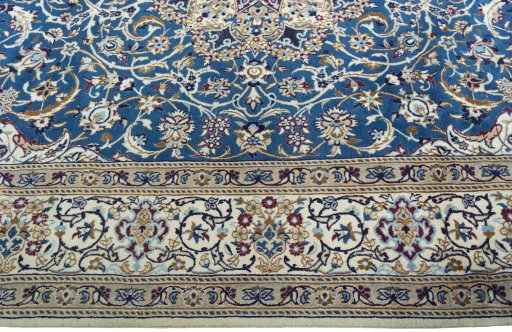 Corner detail of 2000s Nain rug showing border pattern and Wool pile