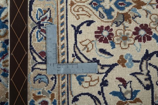 Backside of handmade 2000s Nain rug showing knot structure and weave density