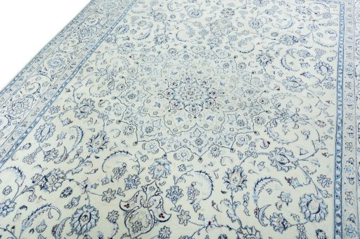 Backside of handmade New Nain rug showing knot structure and weave density