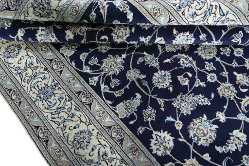 Close-up detail of 2000s Nain rug from Iran / Persia showing Wool weave