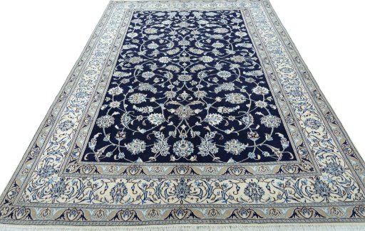 Surface texture of 2000s Nain rug with natural Wool and intricate pattern