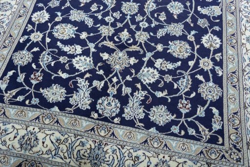 Close-up detail of 2000s Nain rug from Iran / Persia showing Wool weave