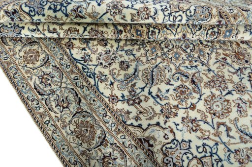 Close-up detail of 2000s Nain rug from Iran / Persia showing Wool weave